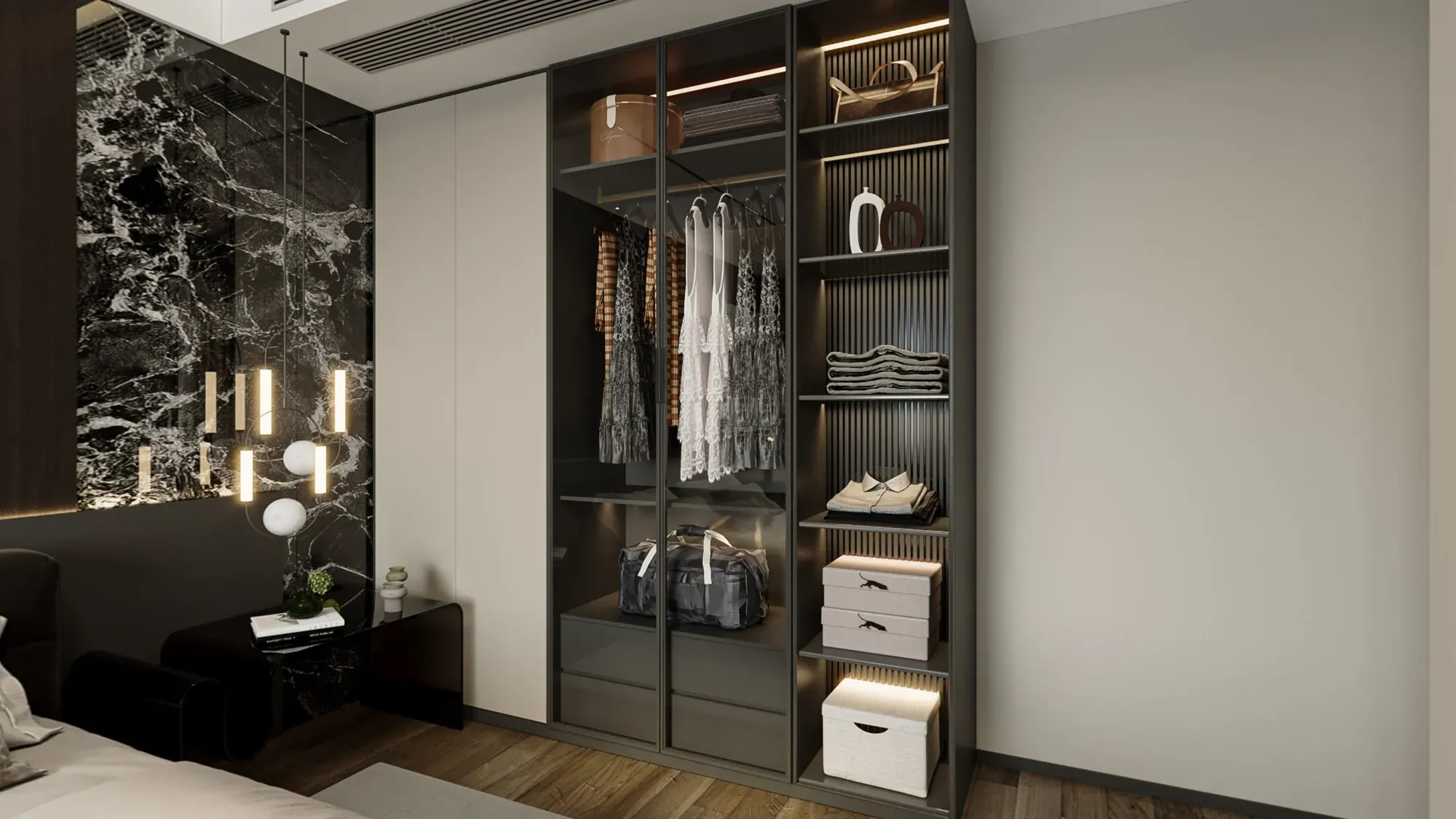 Master wardrobe and marble bedside detail with illuminated display storage