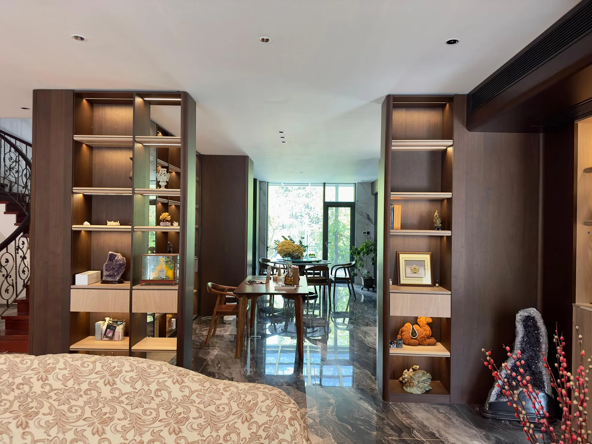 Installed Kazakhstan villa interior with dark timber display joinery framing the living and dining area