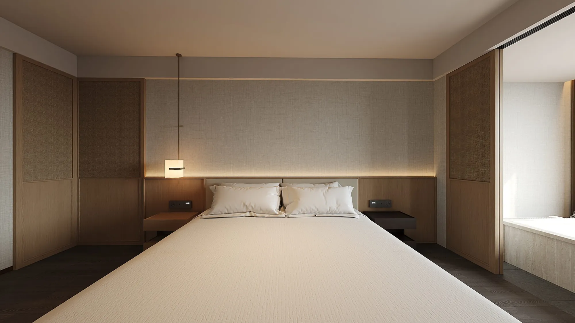 Hotel suite bedroom connected to a daylit stone bath area