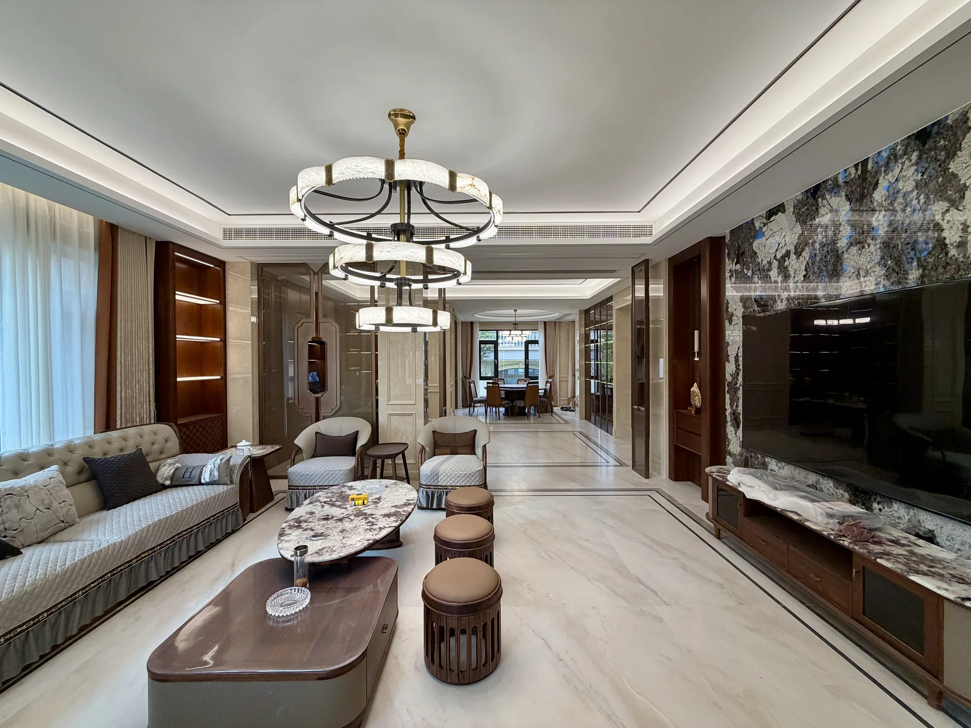 Kyrgyzstan walnut modern classic villa living room with stone floor and tiered chandelier