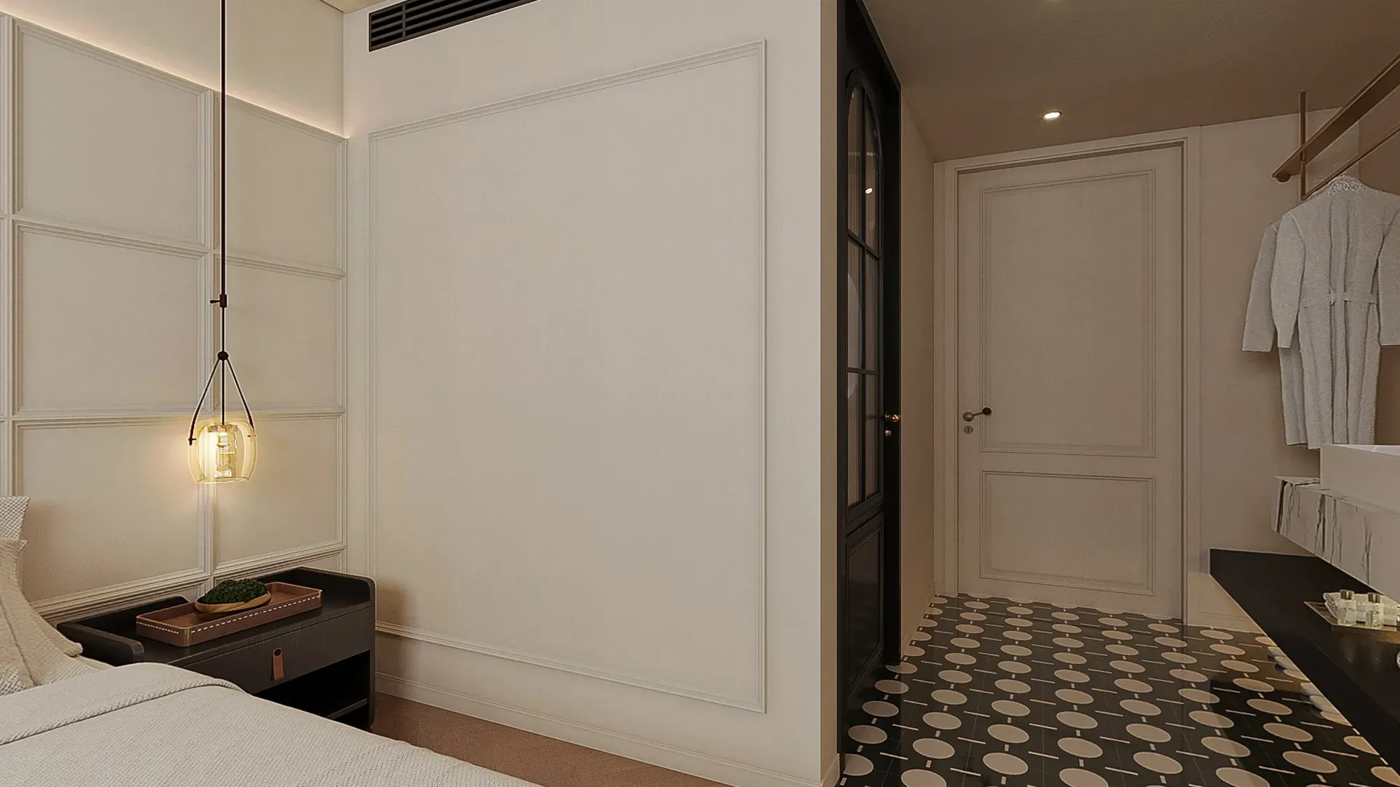 Hotel guestroom entry with fitted storage and graphic patterned flooring
