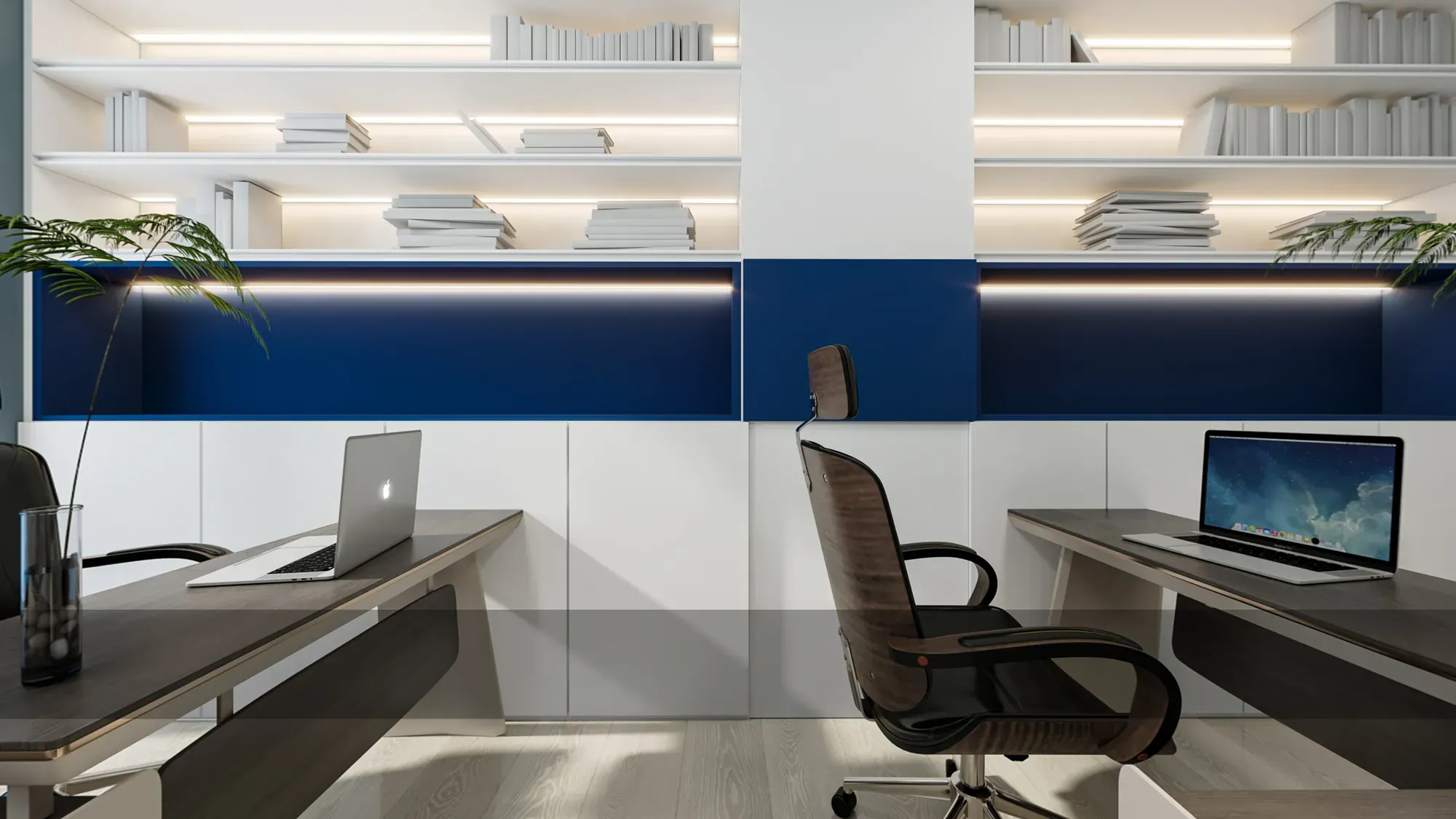 Open office workstations with blue acoustic wall panels and integrated shelves