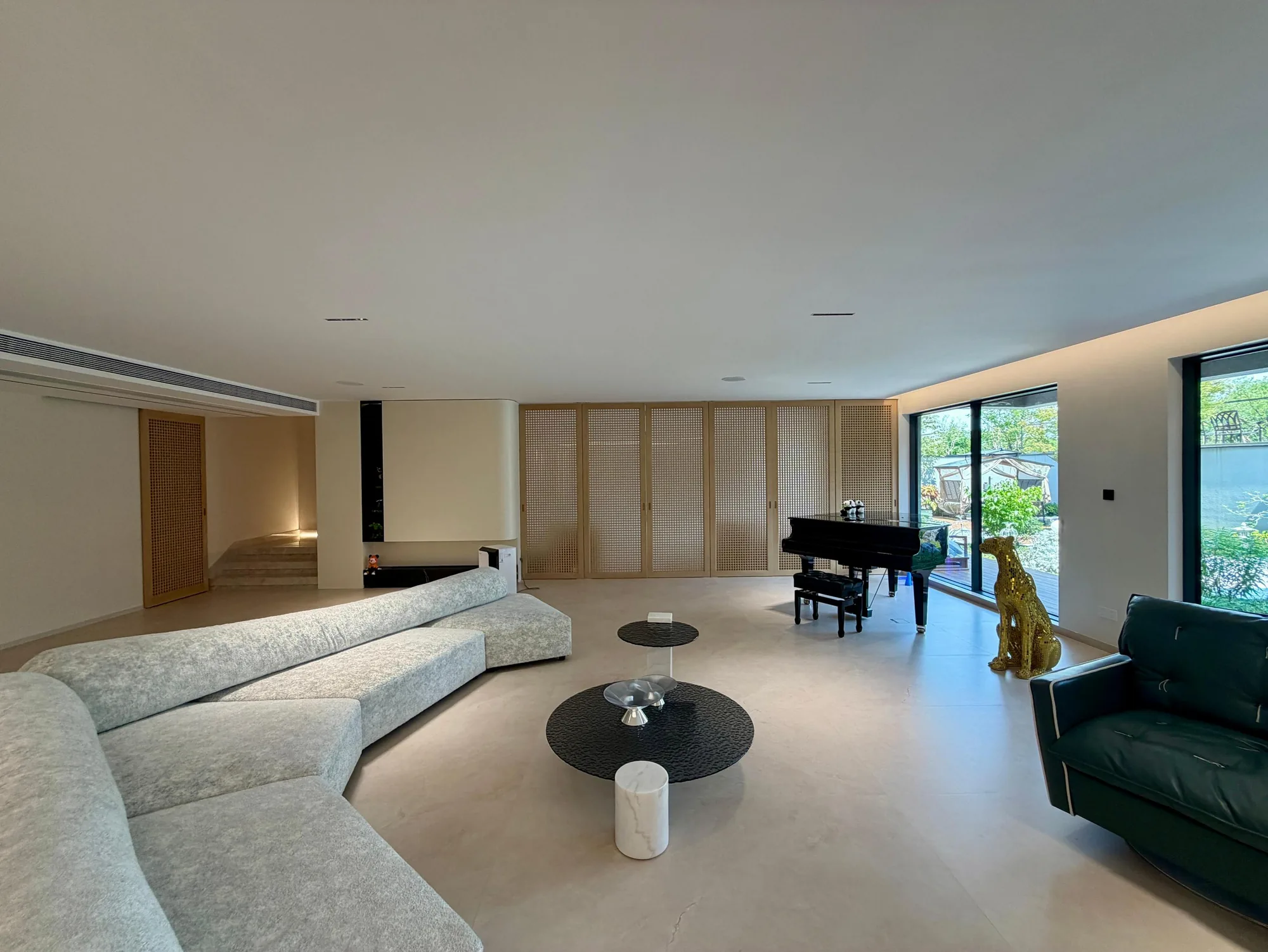 South Africa warm contemporary Italian villa living room with open garden views