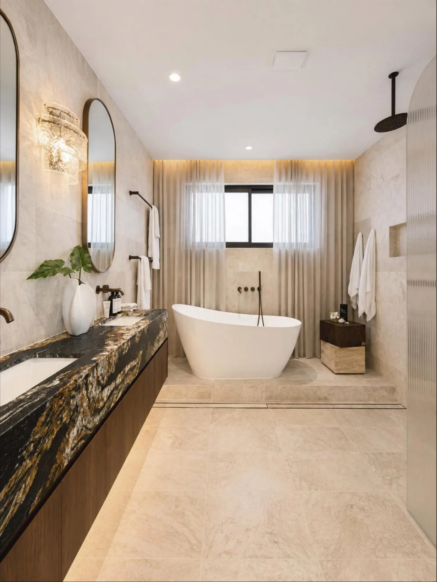 Warm contemporary bathroom with marble surfaces, dark vanity and glass shower