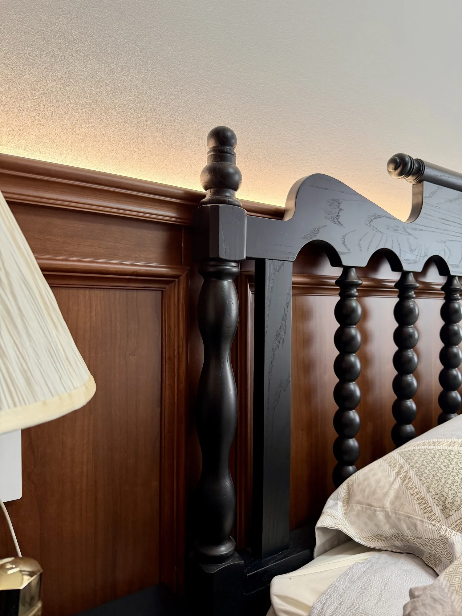 Detail of carved timber furniture and coordinated bedroom panels