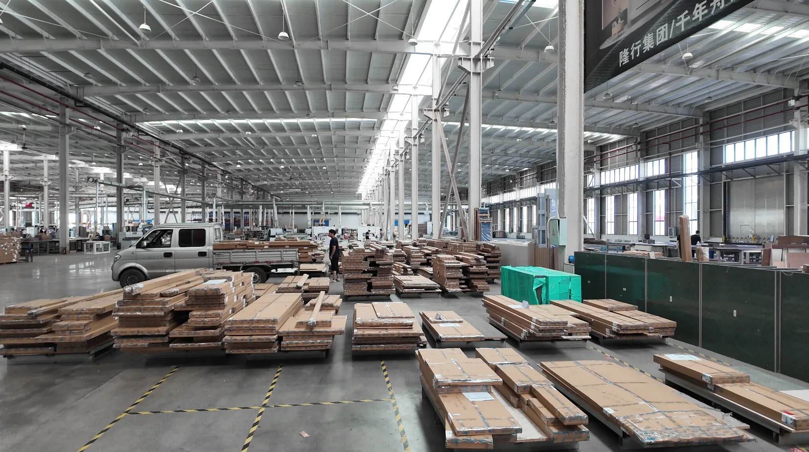 Packaged cabinet components staged in the GREENWAY factory