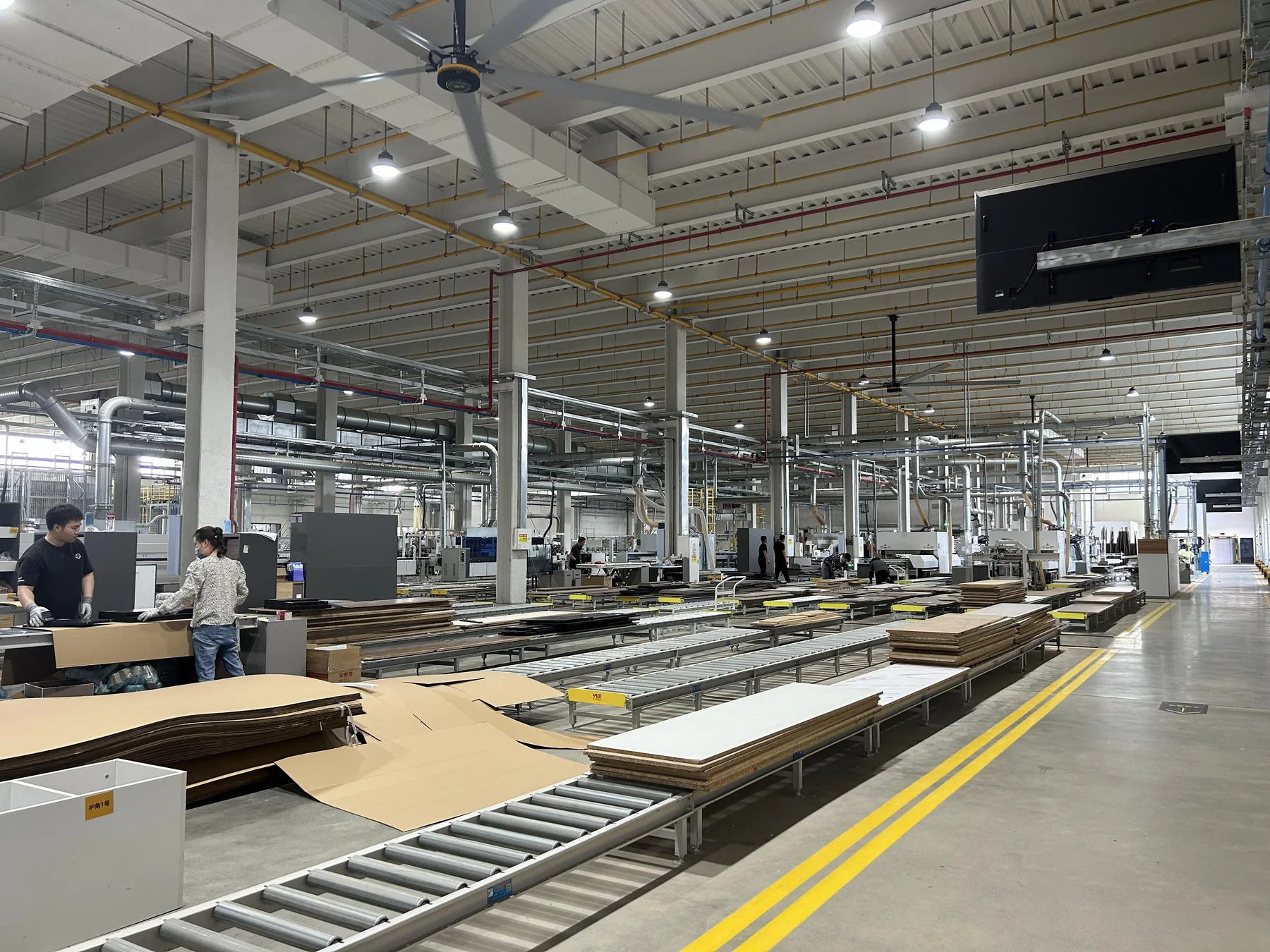 GREENWAY cabinet production floor with panel lines and operators