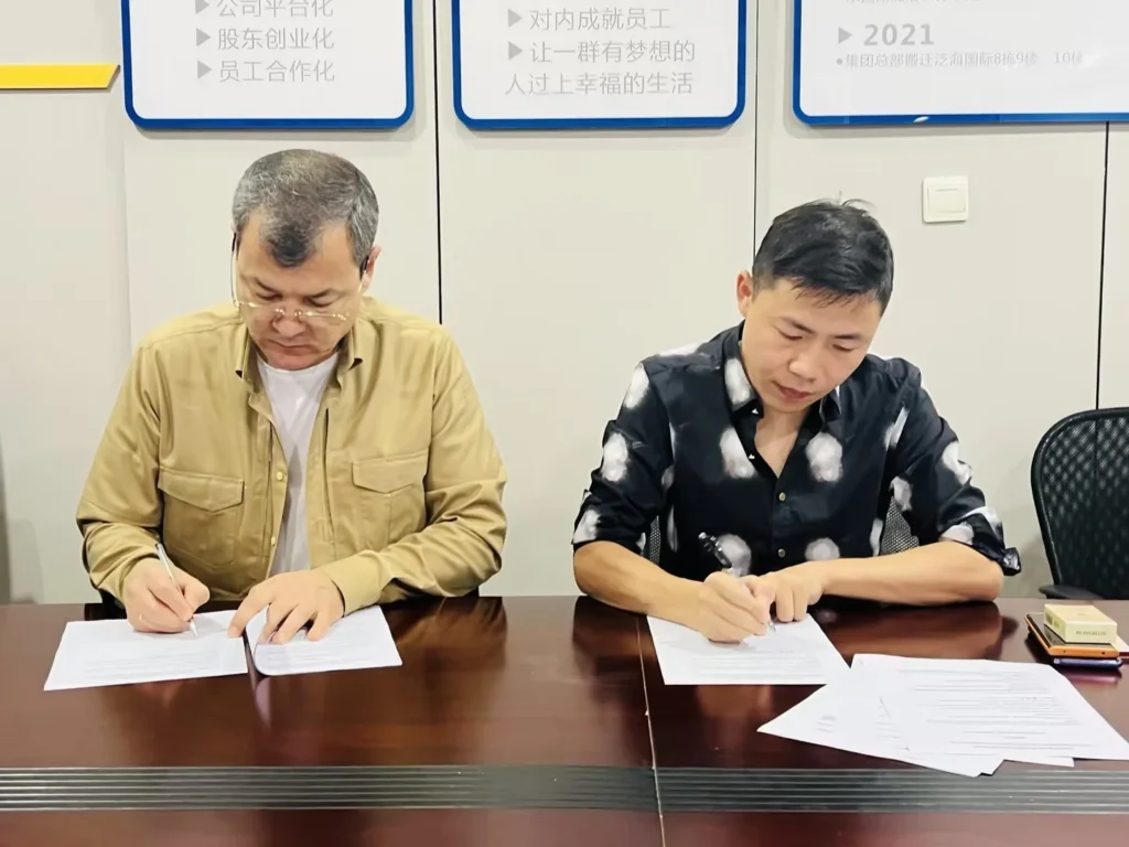 Greenway representative and client signing a business cooperation agreement